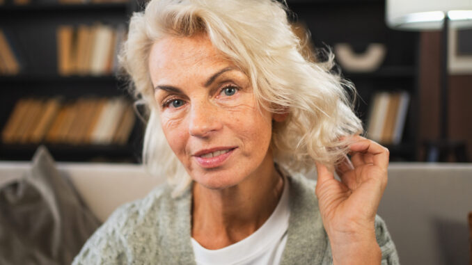 Portrait of confident stylish European middle aged senior woman. Older mature 60s lady smiling at home. Happy attractive senior female looking camera close up face headshot portrait. Happy people.