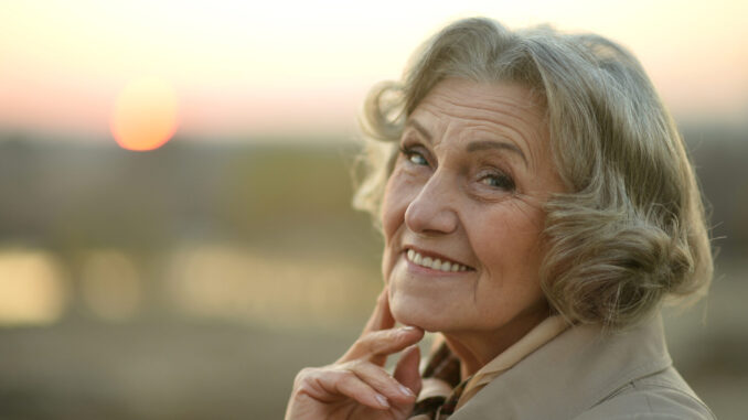 senior woman posing outdoors
