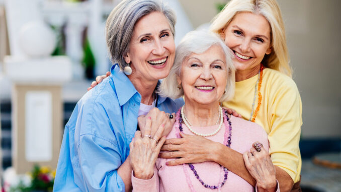 Beautiful senior women bonding outdoors