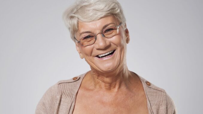 Portrait of happy elegant senior woman
